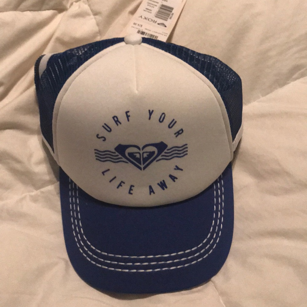 A blue and white Roxy baseball hat